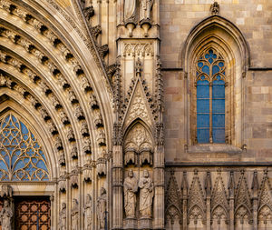 Low angle view of ornate window of historic building