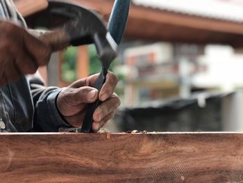 Midsection of man working outdoors