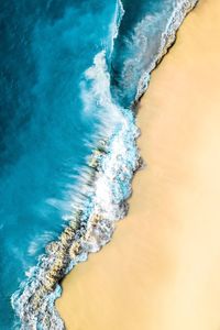 High angle view of surf on beach