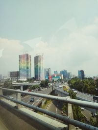 Buildings in city against sky