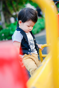 Cute boy playing at playground
