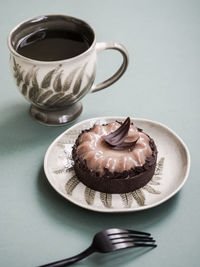 Close-up of coffee cup on table