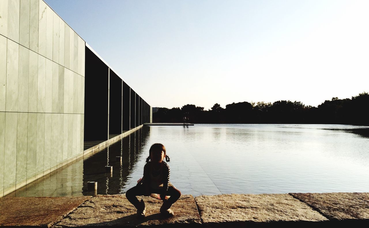 full length, one person, sitting, outdoors, one woman only, only women, real people, sky, leisure activity, adults only, day, people, adult, nature