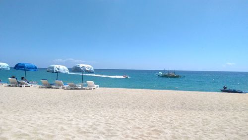 Scenic view of calm sea against clear sky