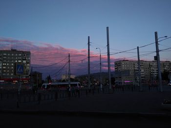 City street against clear sky at dusk