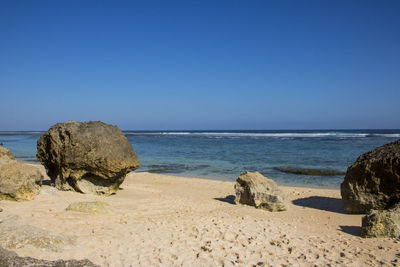 Scenic view of sea against clear blue sky