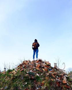 Woman standing against clear blue sky