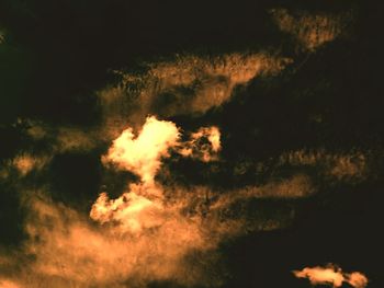 Low angle view of fire at sunset