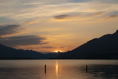 Scenic view of lake against sky during sunset