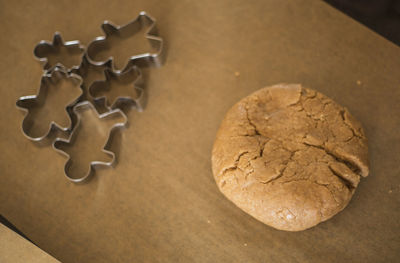 Close-up of cookie with pastry cutters on table