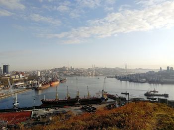 High angle view of marina at harbor against sky