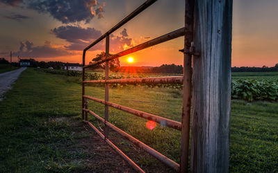 Scenic view of field against sky during sunset