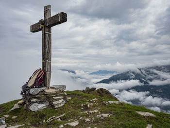 Wood cross on a mountain veto on lake como