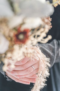 Cropped hand holding flower