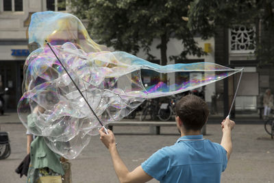Man holding bubbles