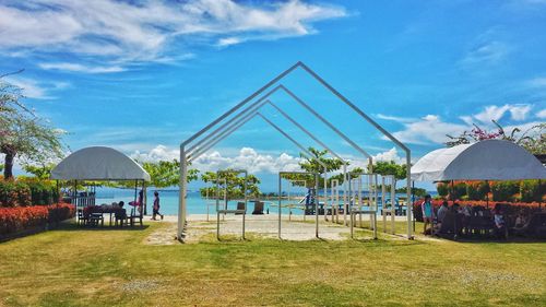 Built structure on field against sky