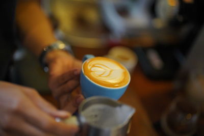 Man holding coffee cup