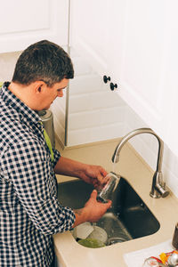 Side view of man working at home
