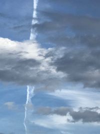 Low angle view of vapor trails in sky