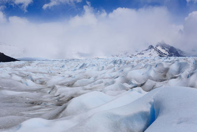 Scenic view of snowcapped landscape against sky