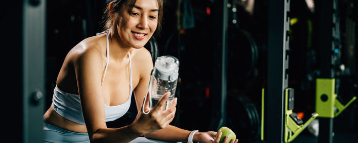 Young woman exercising in gym