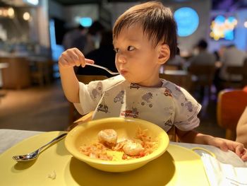 Close-up of boy eating food