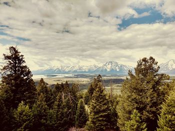 Scenic view of mountains against cloudy sky