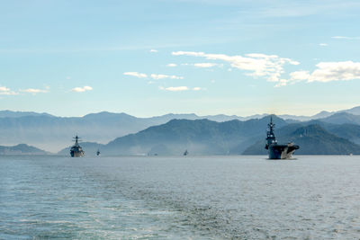 Scenic view of sea against cloudy sky