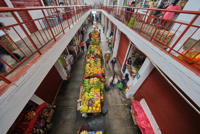 High angle view of people on footbridge in city