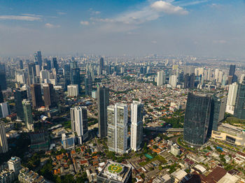 Aerial view of cityscape against sky