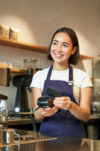 Young woman using mobile phone