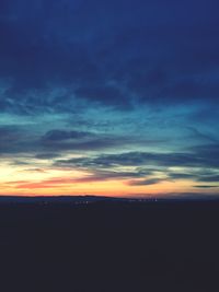 Scenic view of silhouette landscape against sky at sunset