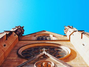 Low angle view of temple against blue sky