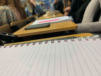 Close-up of book at desk in classroom