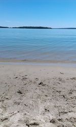 Scenic view of calm sea against clear sky