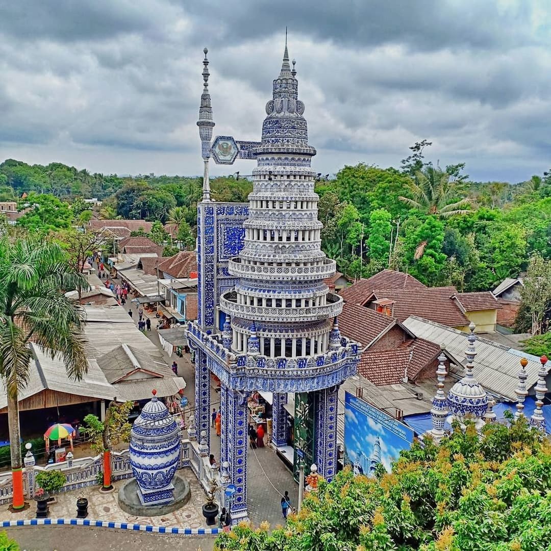 architecture, building exterior, built structure, tree, building, travel destinations, cloud - sky, sky, nature, plant, city, travel, tourism, religion, place of worship, incidental people, belief, tower, outdoors, spire, cityscape