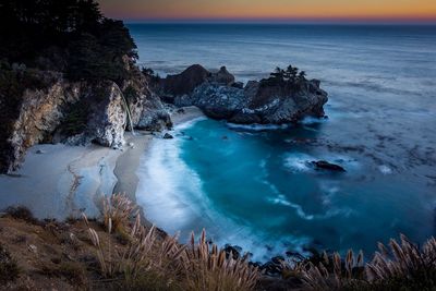 Twilight at the beach waterfall