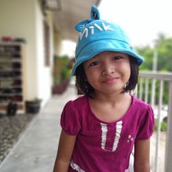 Portrait of smiling girl standing outdoors