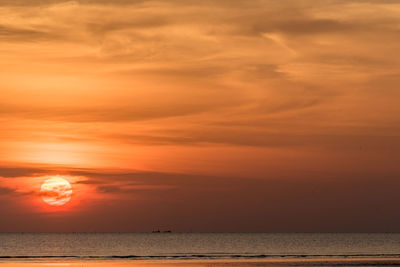 Scenic view of sea against romantic sky at sunset