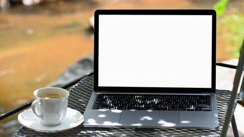 Close-up of coffee cup on table