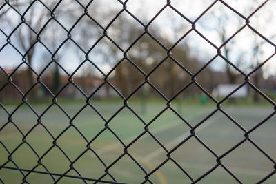 Full frame shot of chainlink fence against sky