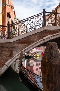 Gondola in small canal in venice