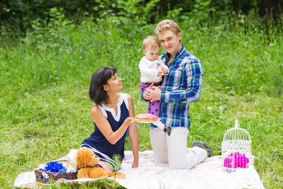 Full length of a smiling girl holding food