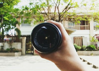 Midsection of person holding camera