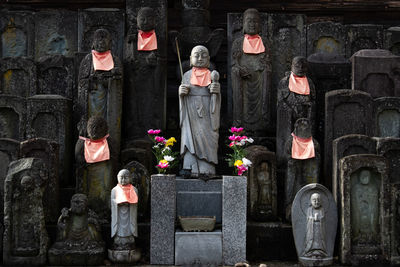 Statue of buddha against plants