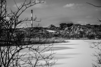 Scenic view of lake against sky during winter