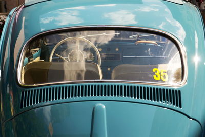 Reflection of car on side-view mirror