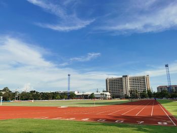 View of soccer field against cloudy sky