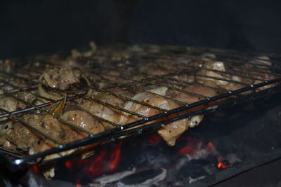 Close-up of meat on barbecue grill