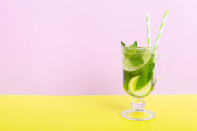 Close-up of drink against pink background